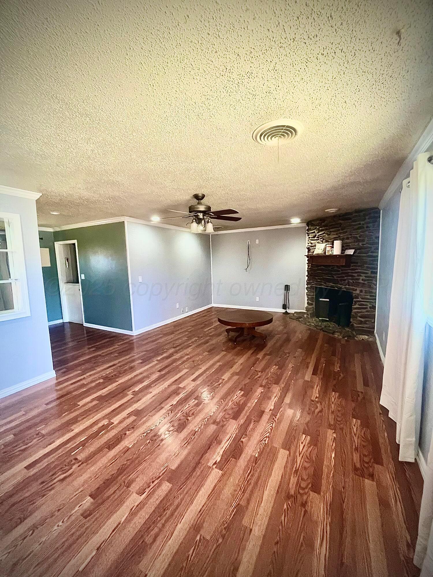 5116 Crockett Street Amarillo, TX 79110 - Photo 2 of 23 a bedroom with a bed and painted walls