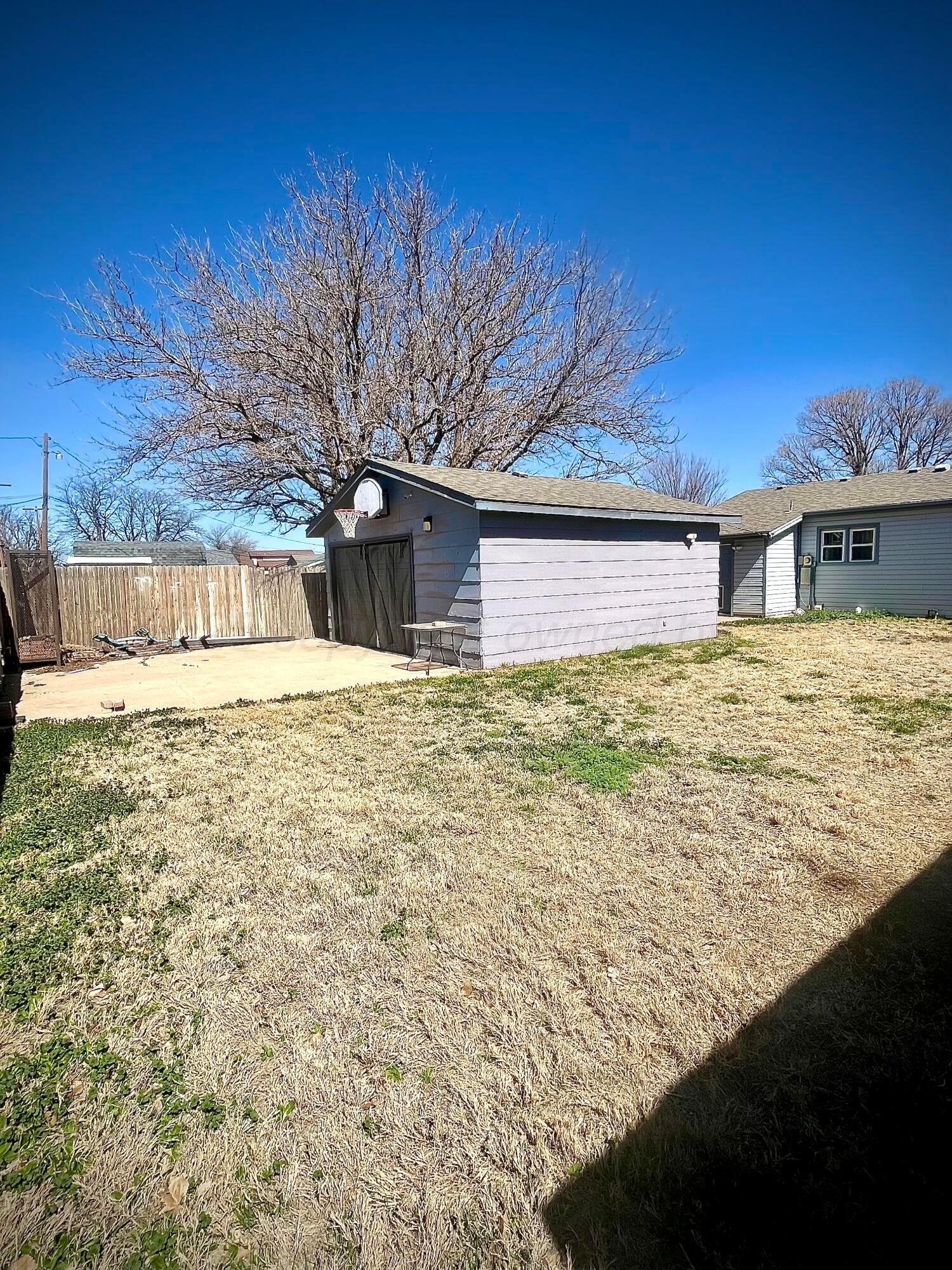 5116 Crockett Street Amarillo, TX 79110 - Photo 21 of 23 a view of a house with a yard