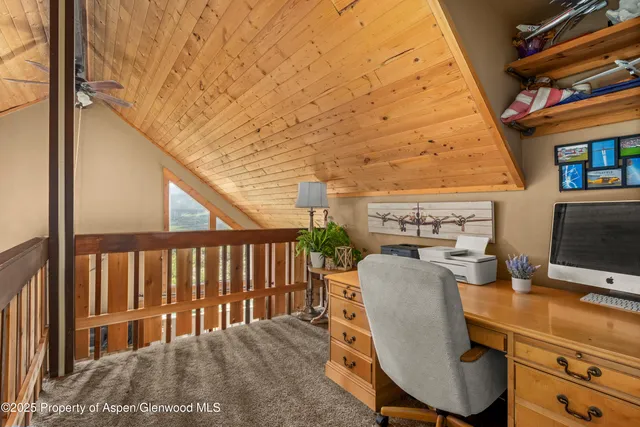 a balcony with table and chairs