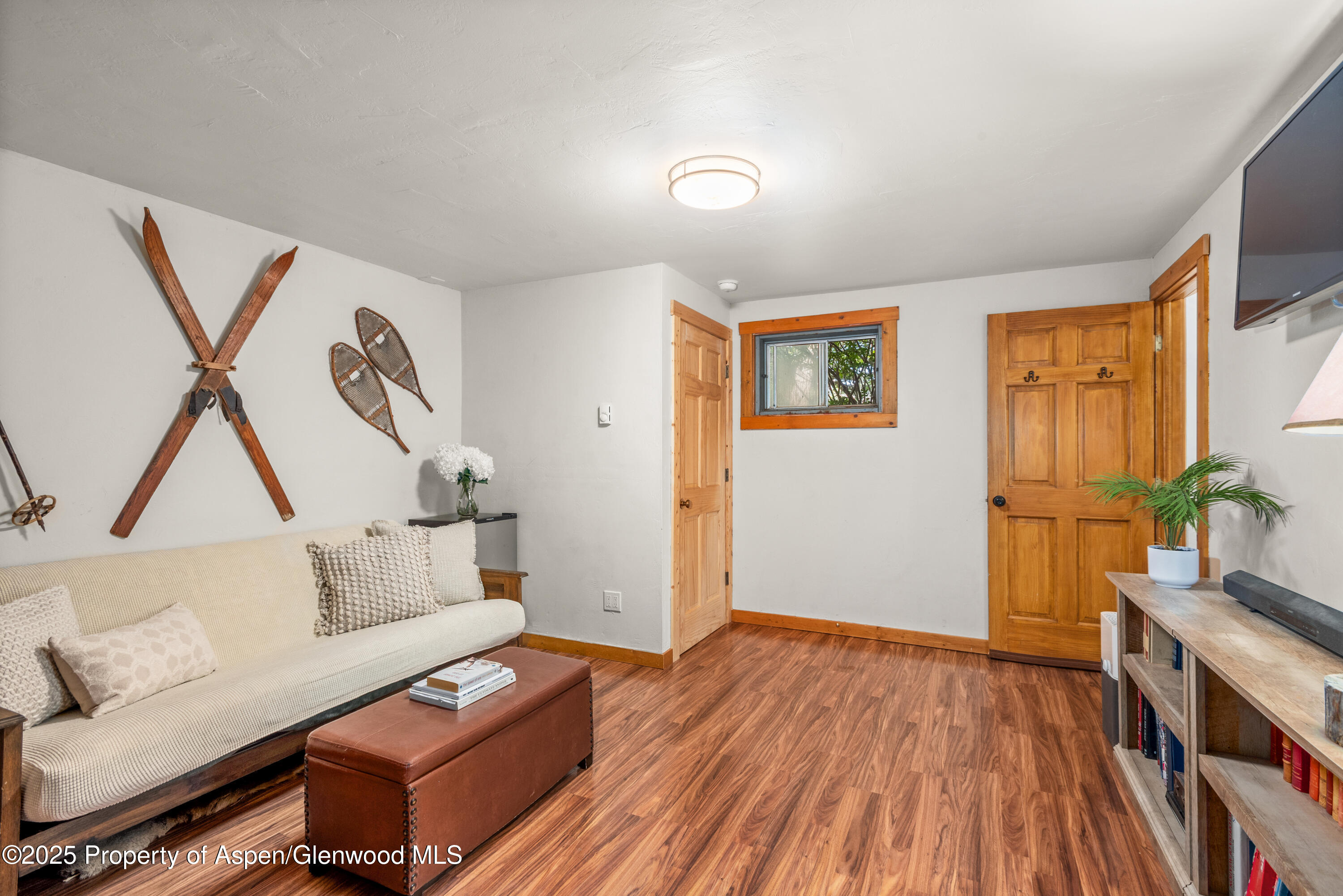 614 Light Hill Road Snowmass, CO 81654 - Photo 18 of 22 a living room with furniture and a wooden floor