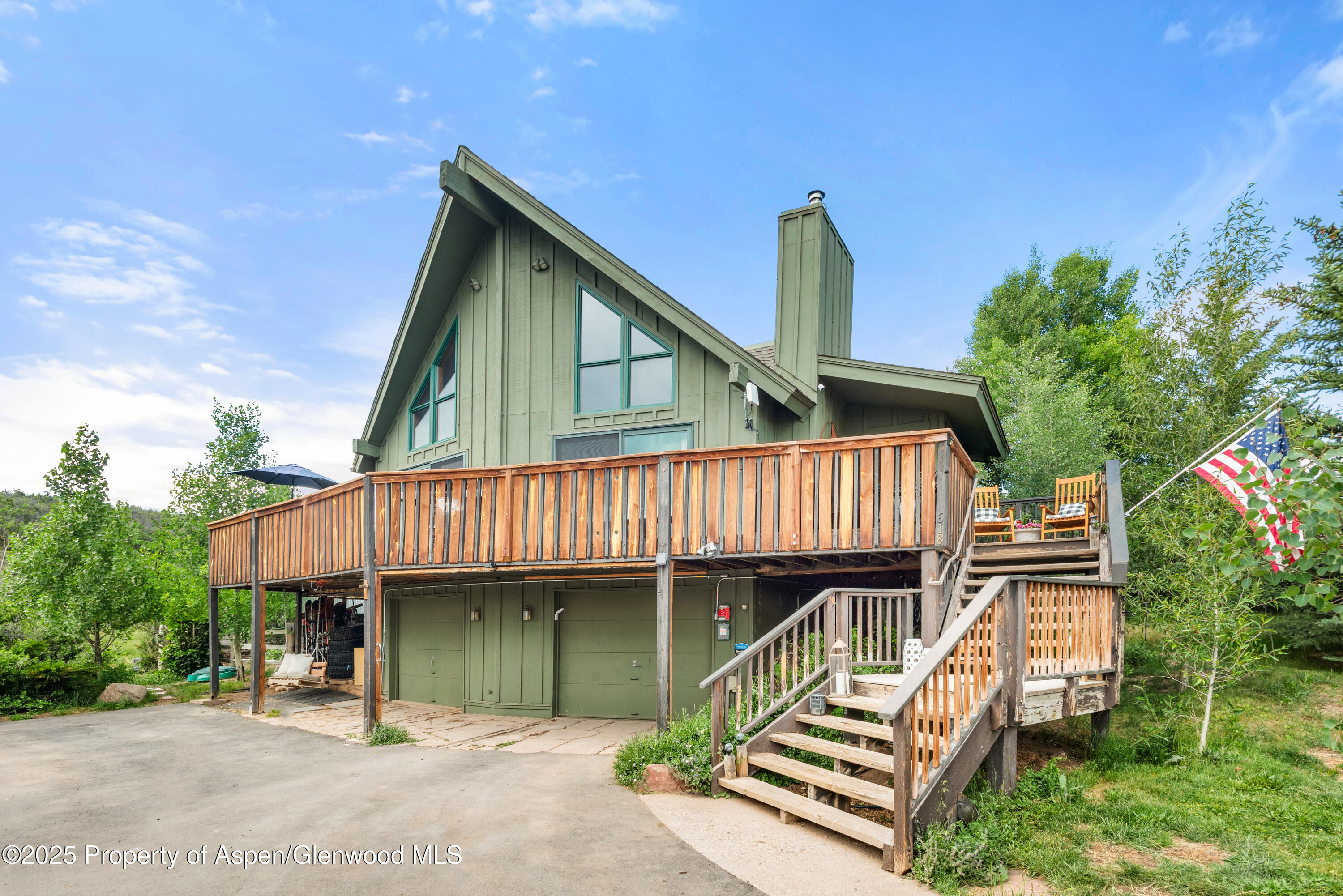 614 Light Hill Road Snowmass, CO 81654 - Photo 19 of 22 a front view of a house with a garden