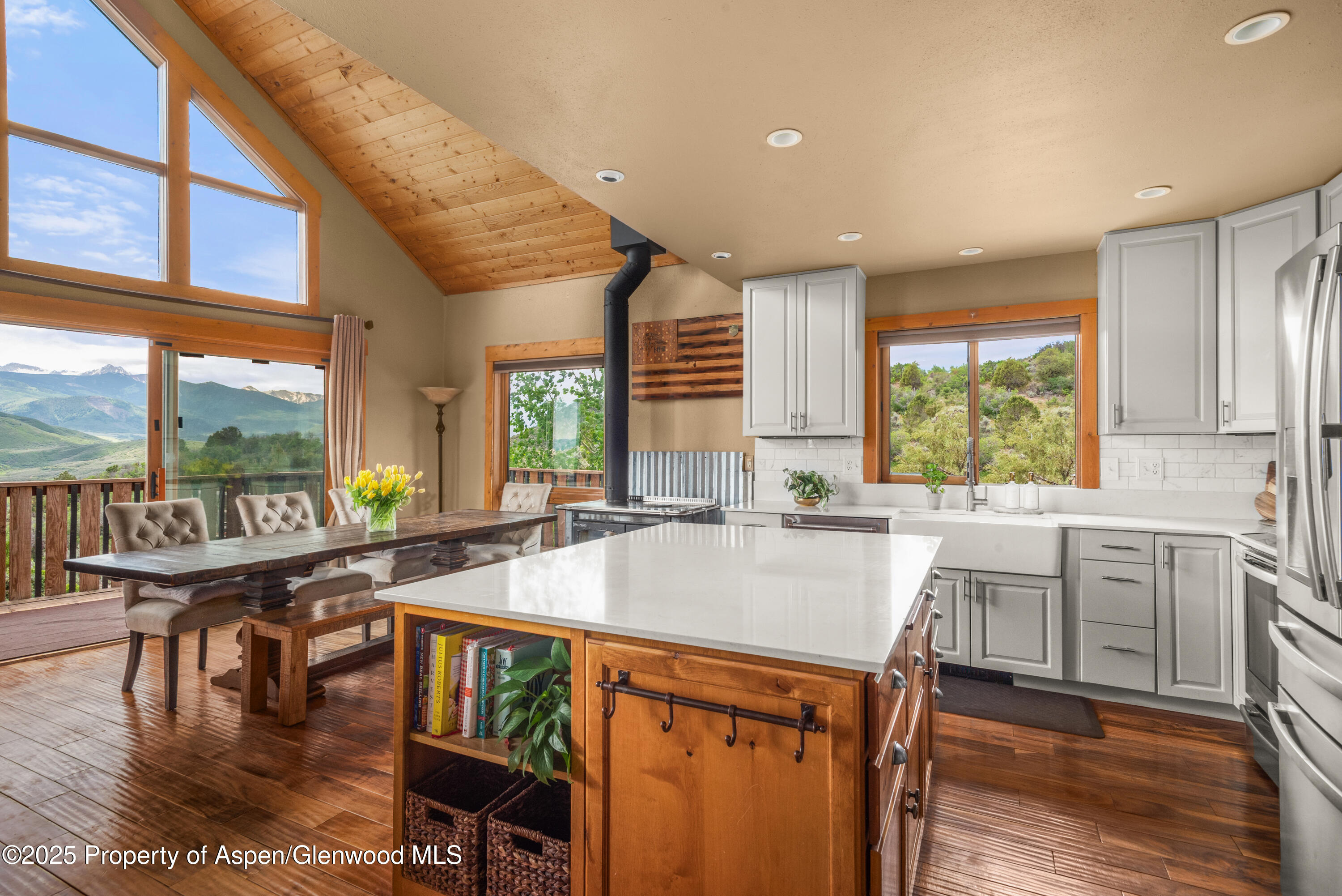 614 Light Hill Road Snowmass, CO 81654 - Photo 5 of 22 a kitchen with a stove a refrigerator and wooden floor