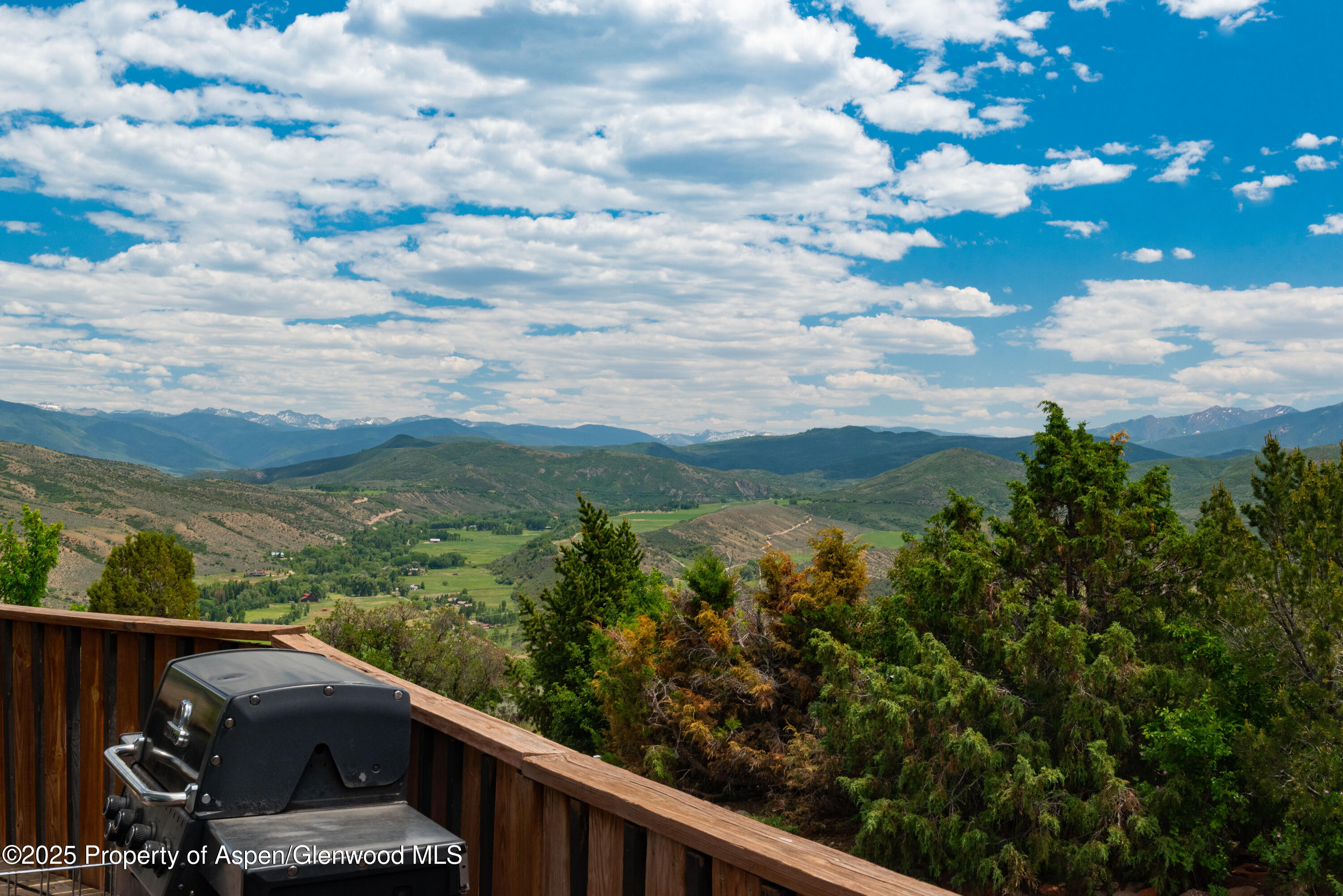 614 Light Hill Road Snowmass, CO 81654 - Photo 7 of 22 a view of balcony with wooden floor and fence