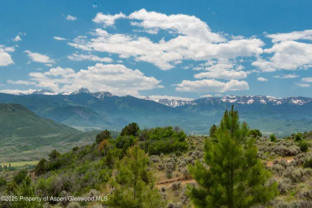 a view of a lake with mountains in the background