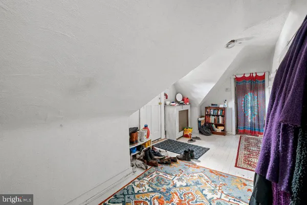 a bed room with a bed and a book shelf