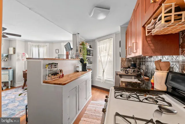 a room with furniture a rug and a window