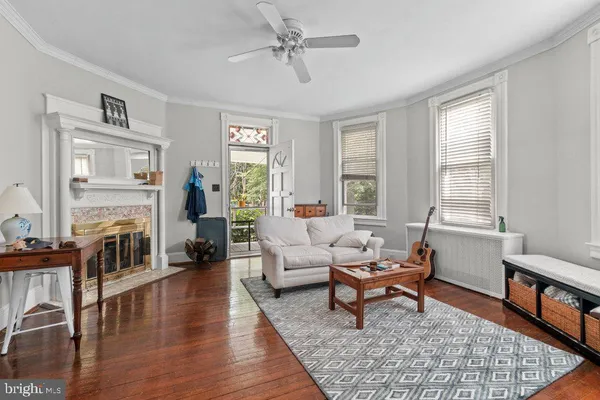 a living room with furniture and a rug