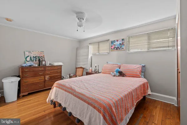 a bedroom with a bed and a table in it