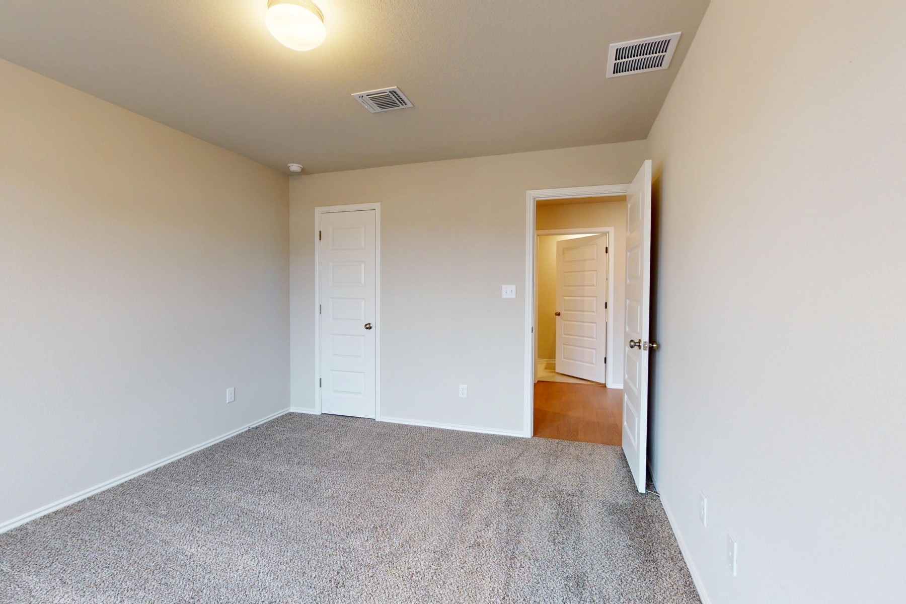 20017 Schatz Way Manor, TX 78653 - Photo 20 of 34 a view of an empty room with wooden floor