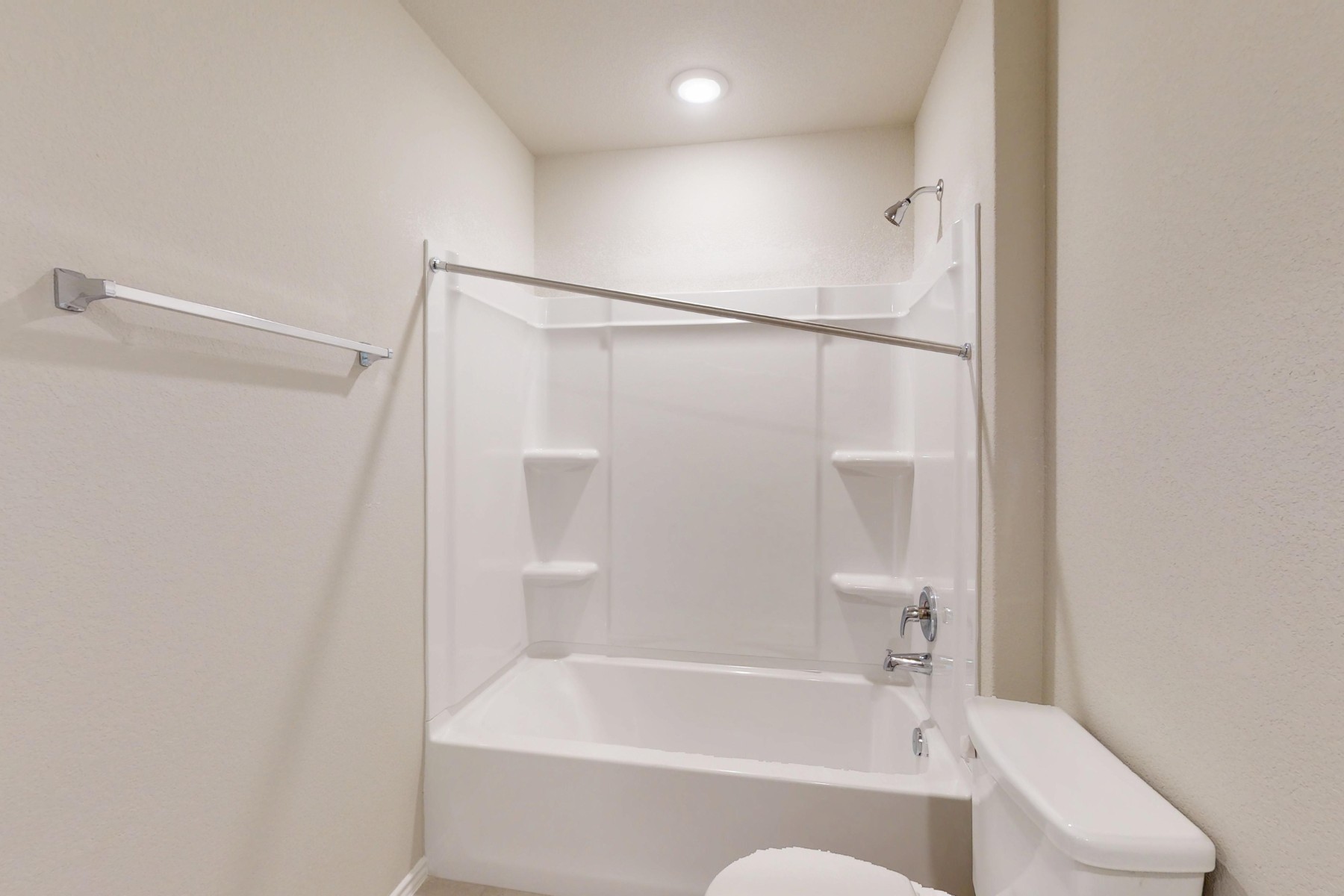 20017 Schatz Way Manor, TX 78653 - Photo 26 of 34 a bathroom with a bathtub and a shower