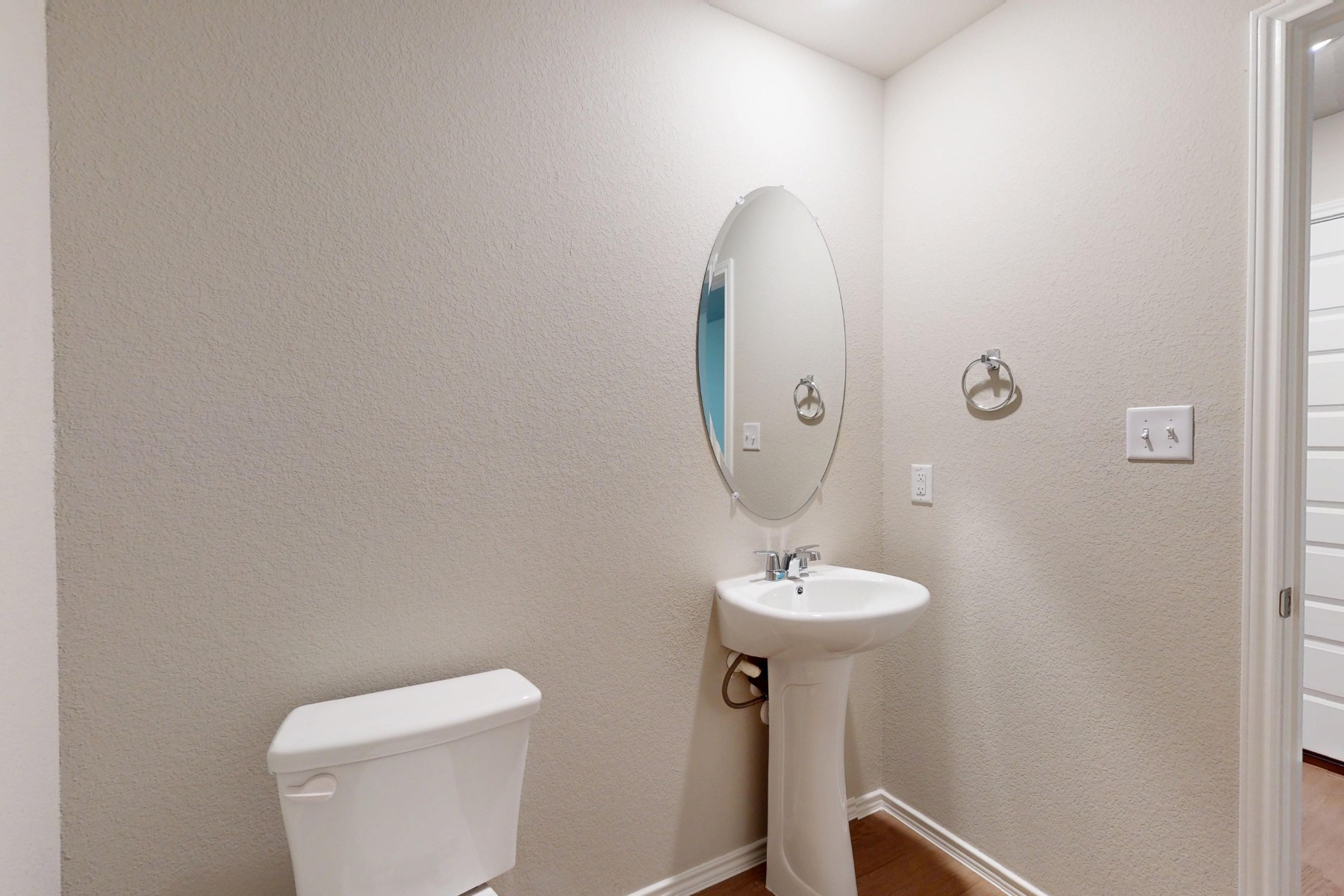 20017 Schatz Way Manor, TX 78653 - Photo 30 of 34 a bathroom with a toilet sink and mirror