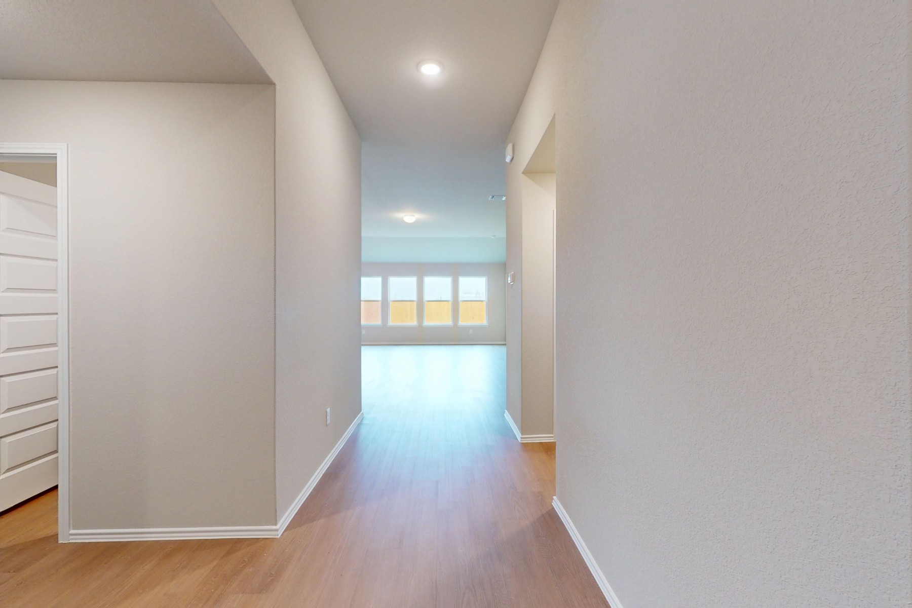20017 Schatz Way Manor, TX 78653 - Photo 31 of 34 a view of a hallway with wooden floor