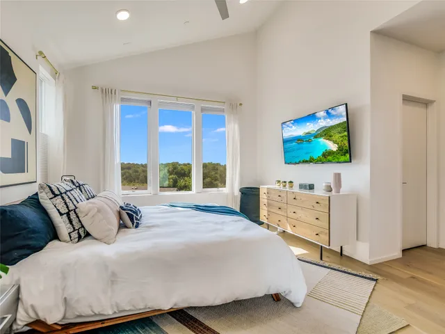 a bedroom with a bed and a dresser