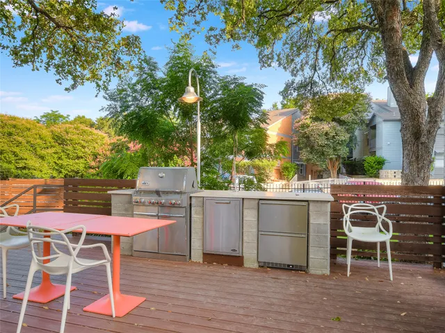 a view of a chairs and table in the patio