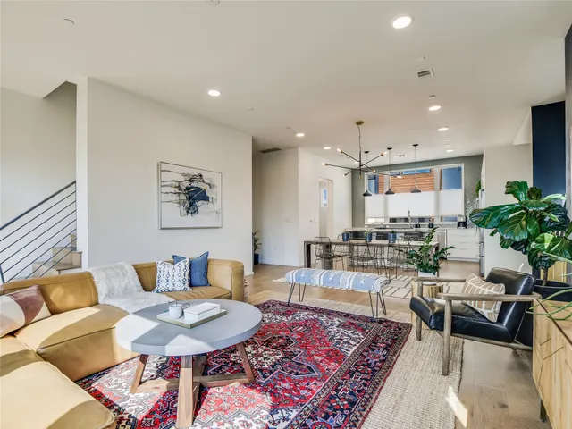 a living room with furniture and a rug
