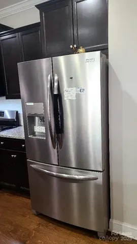 a close view of sink and stainless steel appliances