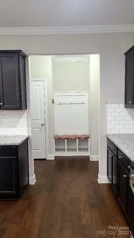 a kitchen with kitchen island a sink stove and refrigerator