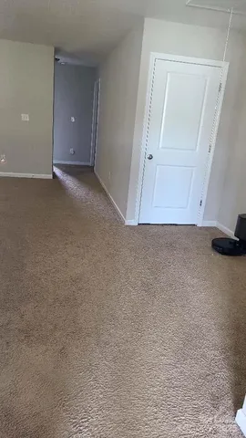 a view of an empty room and entryway