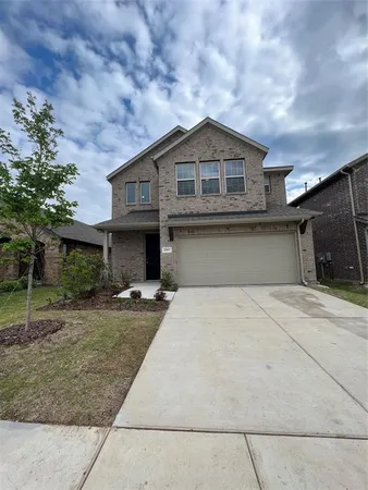 a front view of a house with garage