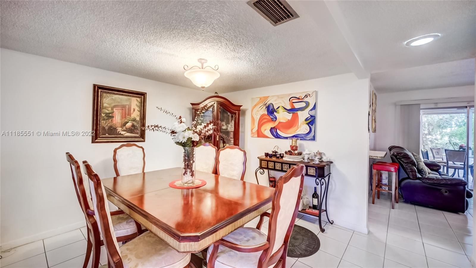 14107 Southwest 66th Street, Unit D7 Miami, FL 33183 - Photo 13 of 38 a view of a dining room with furniture
