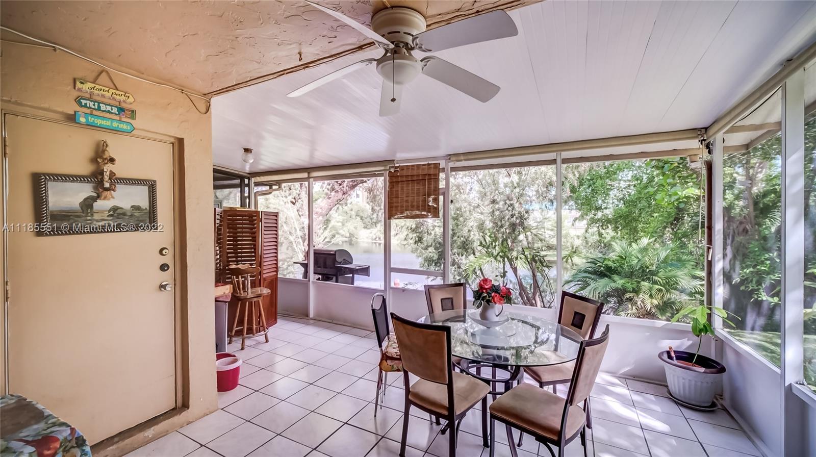 14107 Southwest 66th Street, Unit D7 Miami, FL 33183 - Photo 15 of 38 a view of a dining room with furniture window and outside view