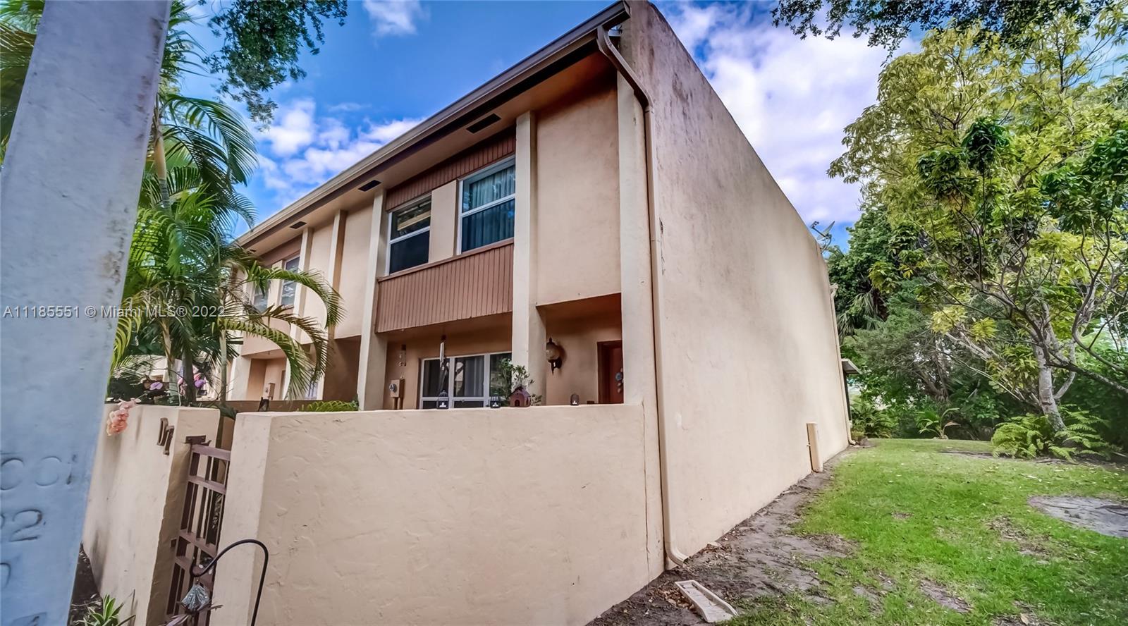 14107 Southwest 66th Street, Unit D7 Miami, FL 33183 - Photo 2 of 38 a view of house with a yard