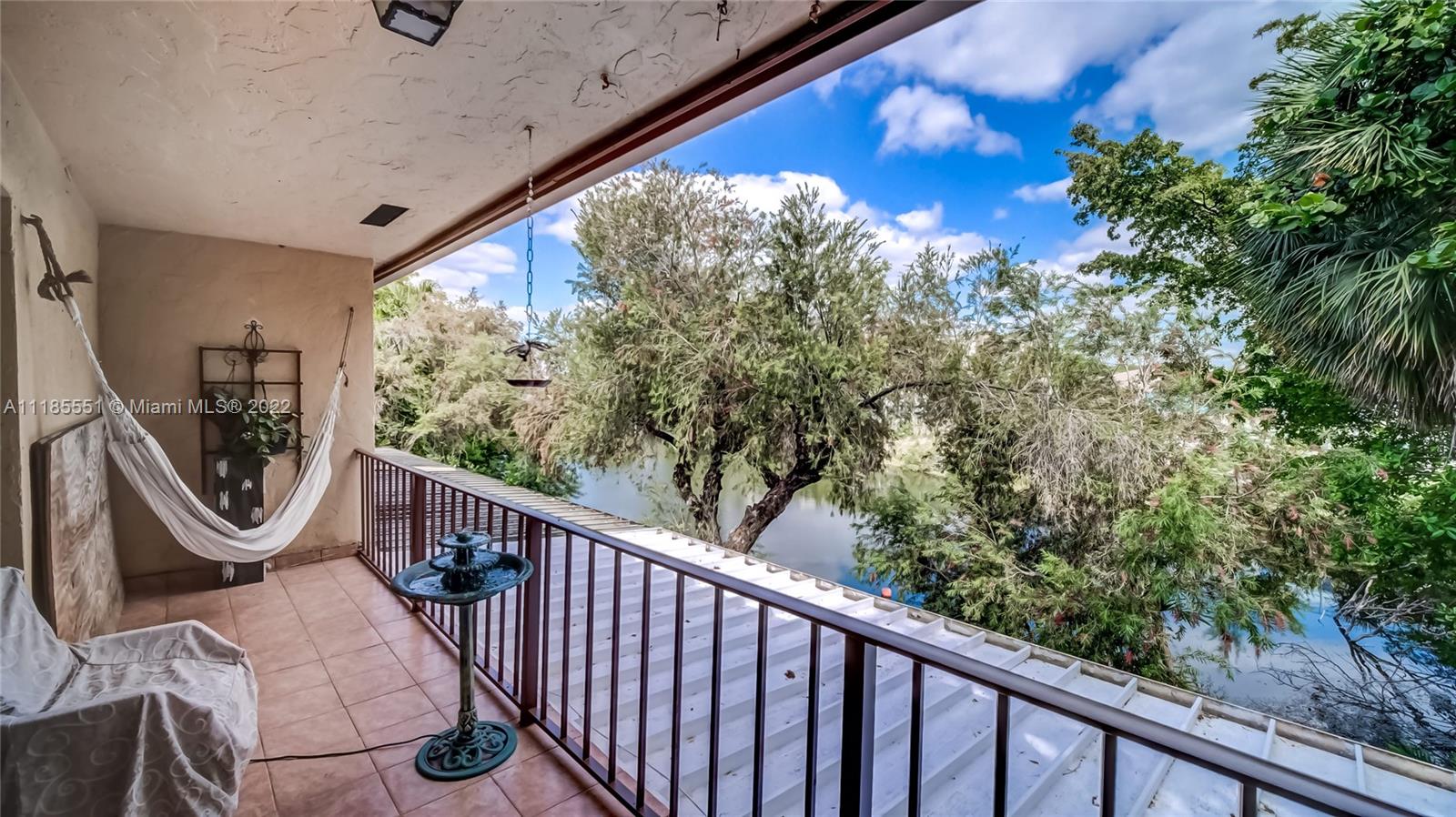 14107 Southwest 66th Street, Unit D7 Miami, FL 33183 - Photo 22 of 38 a view of a balcony with furniture