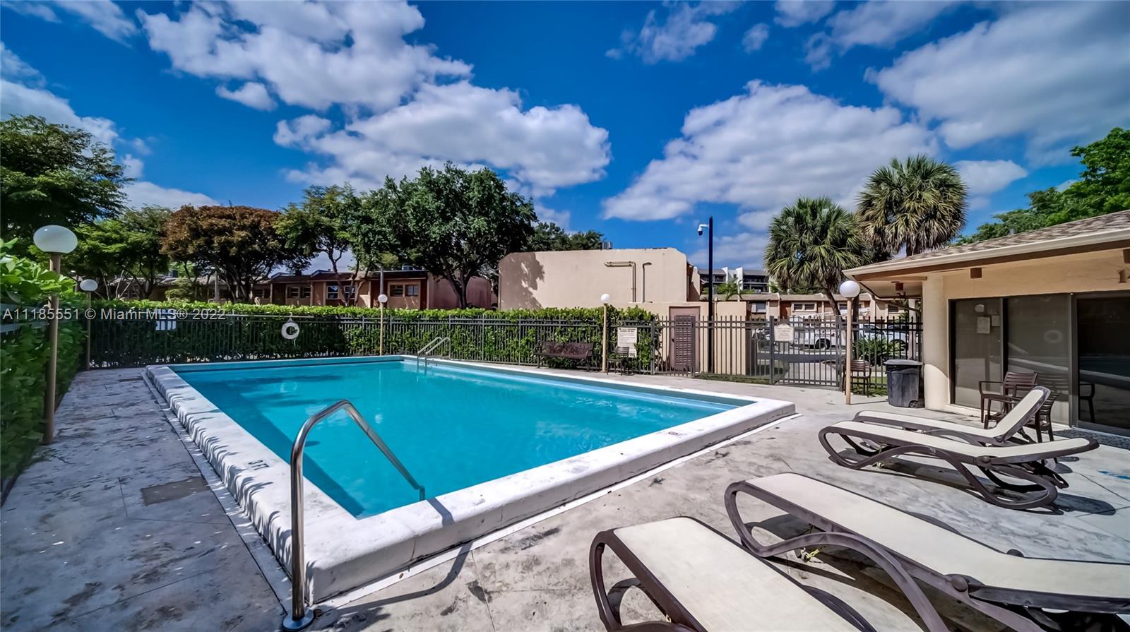 14107 Southwest 66th Street, Unit D7 Miami, FL 33183 - Photo 28 of 38 a view of a backyard with sitting area