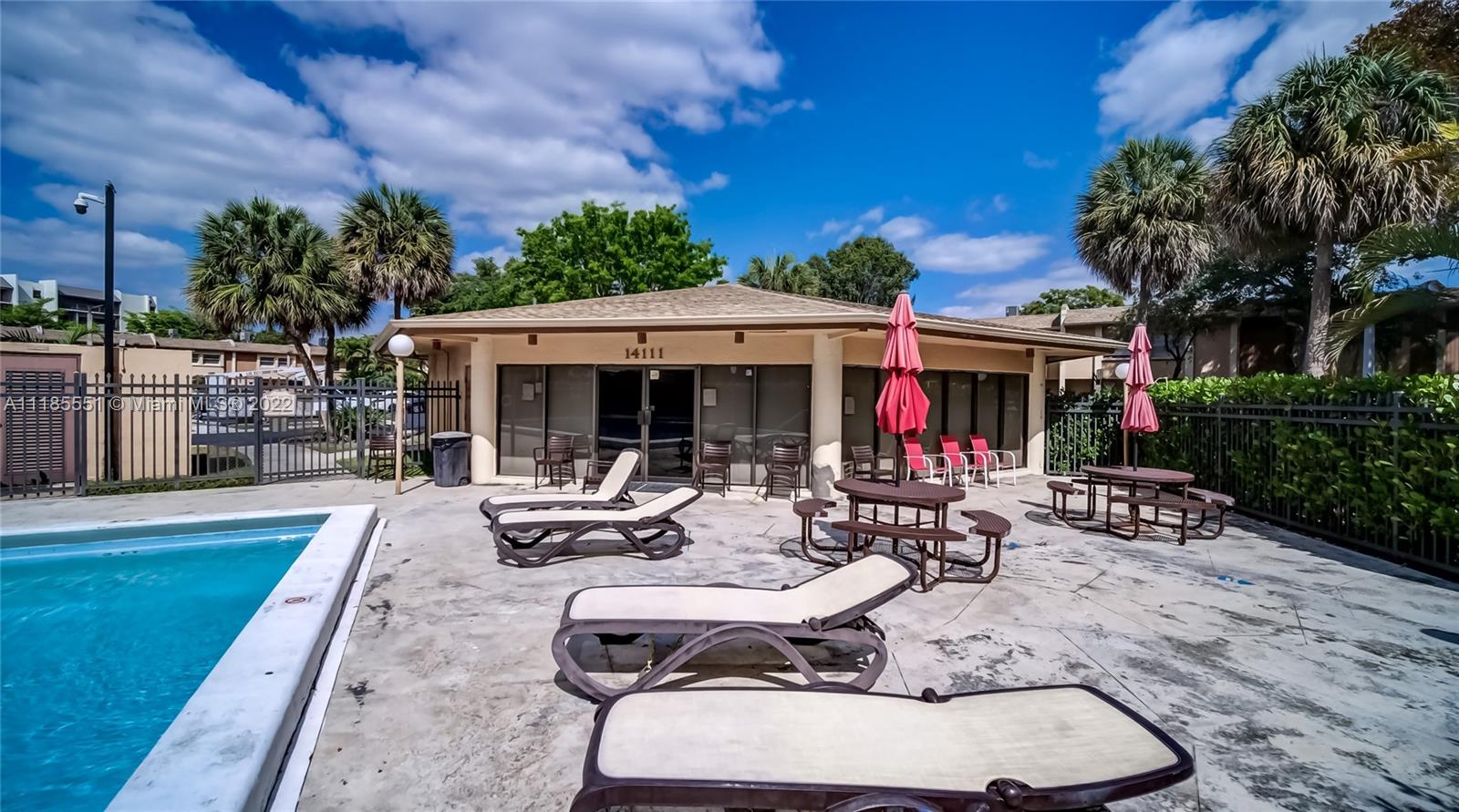14107 Southwest 66th Street, Unit D7 Miami, FL 33183 - Photo 29 of 38 a view of a patio with couches table and chairs and potted plants