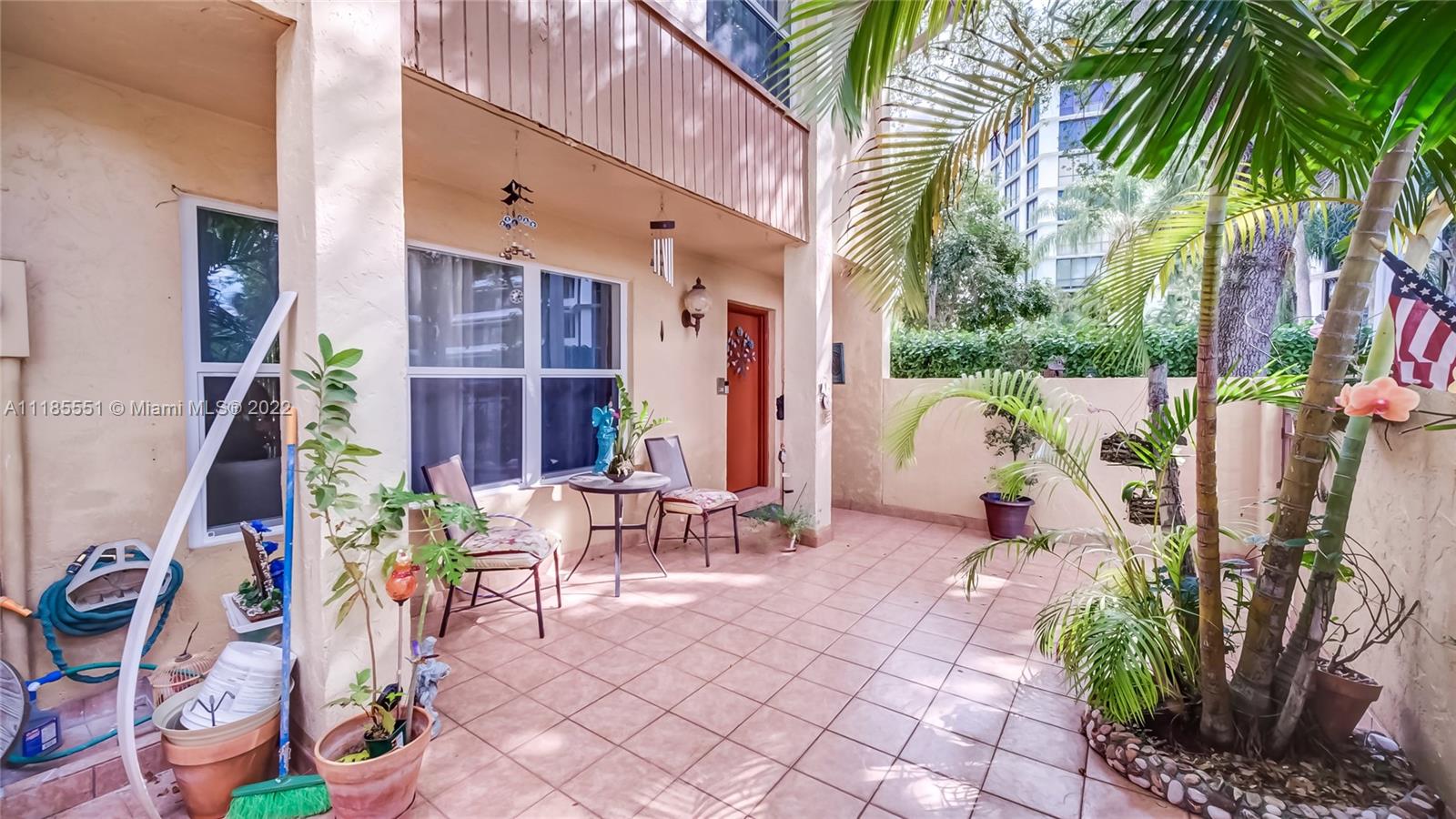 14107 Southwest 66th Street, Unit D7 Miami, FL 33183 - Photo 3 of 38 a view of outdoor space yard and patio