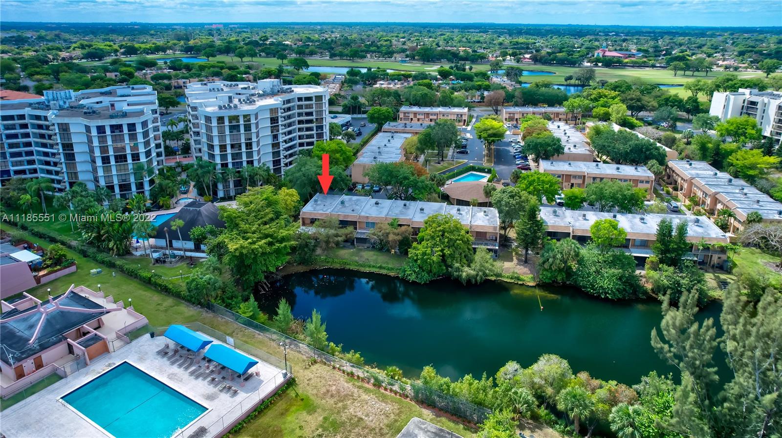 14107 Southwest 66th Street, Unit D7 Miami, FL 33183 - Photo 34 of 38 a view of a city with plants and large trees