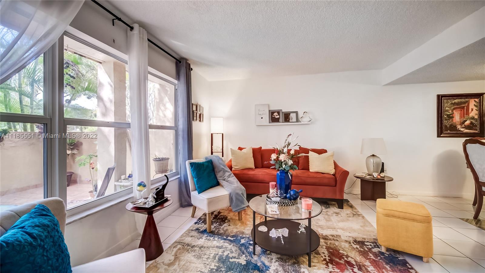 14107 Southwest 66th Street, Unit D7 Miami, FL 33183 - Photo 6 of 38 a living room with furniture and a large window