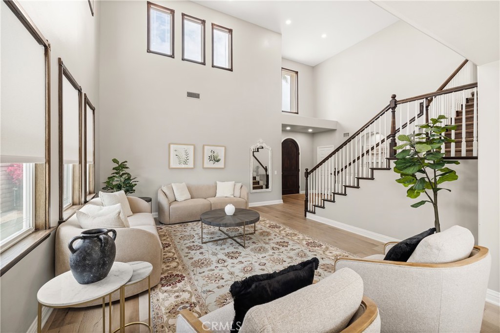 Dramatic two-story entry with elegant staircase