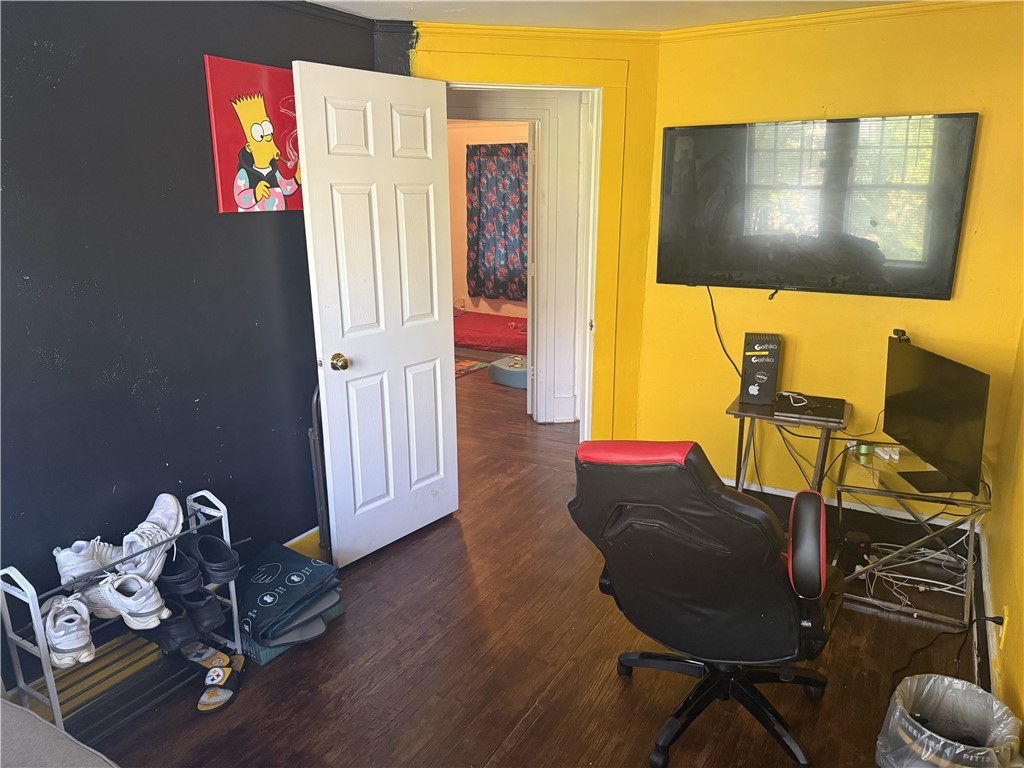 417 South Seigel Street Decatur, IL 62522 - Photo 8 of 11 a view of a workspace with furniture and screen tv