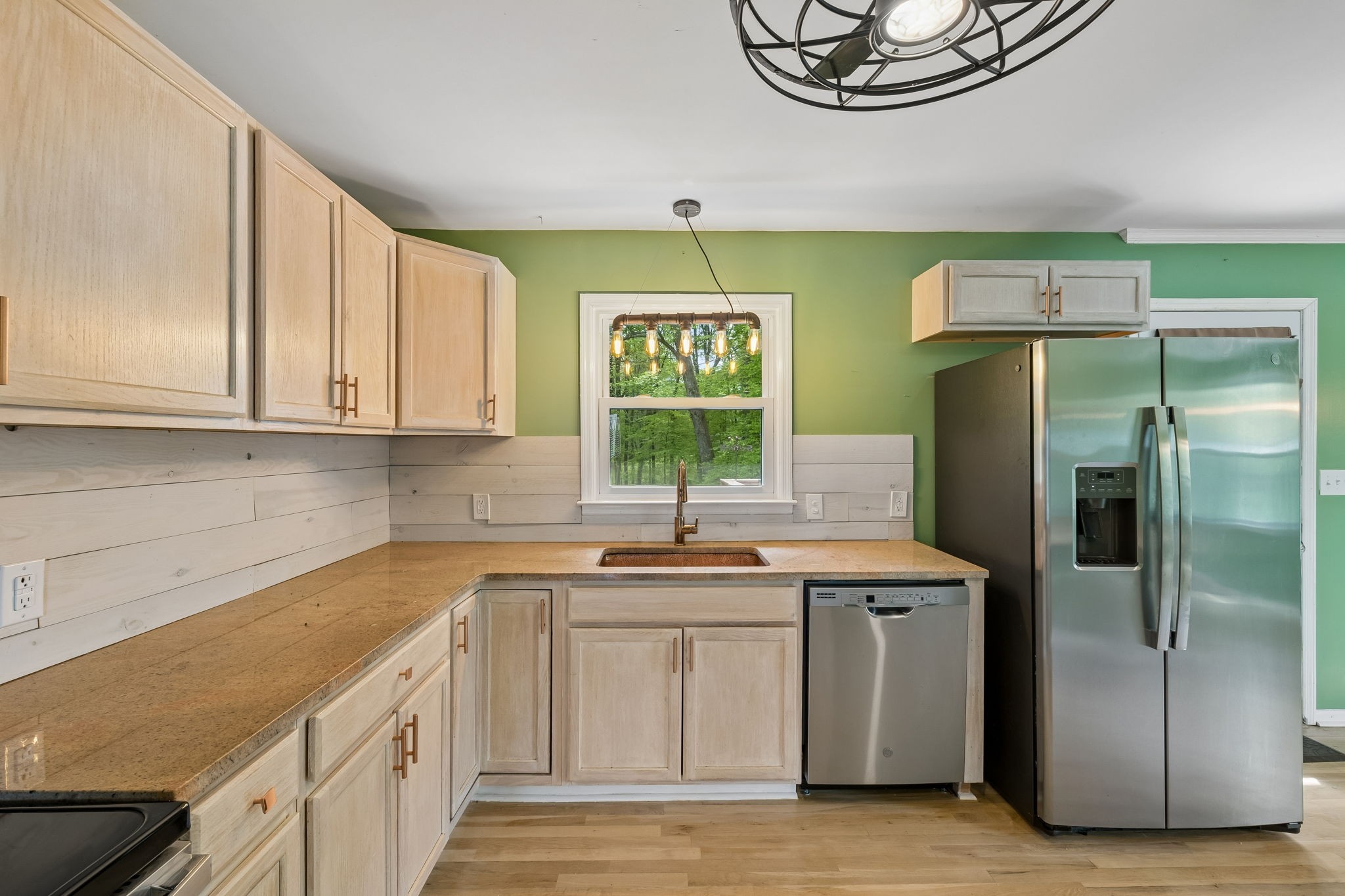 771 Mt Pleasant Road Kingston Springs, TN 37082 - Photo 11 of 31 a kitchen with stainless steel appliances granite countertop a sink a stove a refrigerator and island