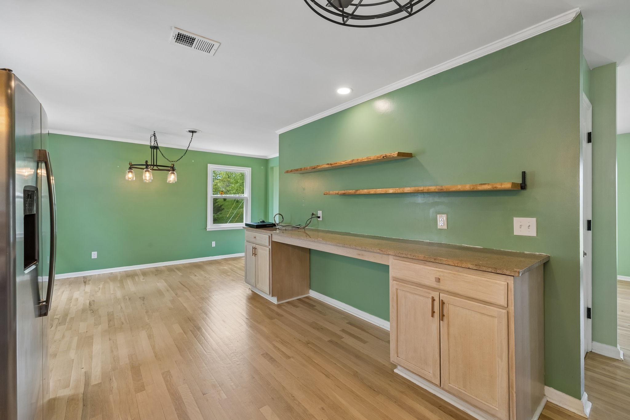 771 Mt Pleasant Road Kingston Springs, TN 37082 - Photo 12 of 31 a kitchen with a wooden floor and window