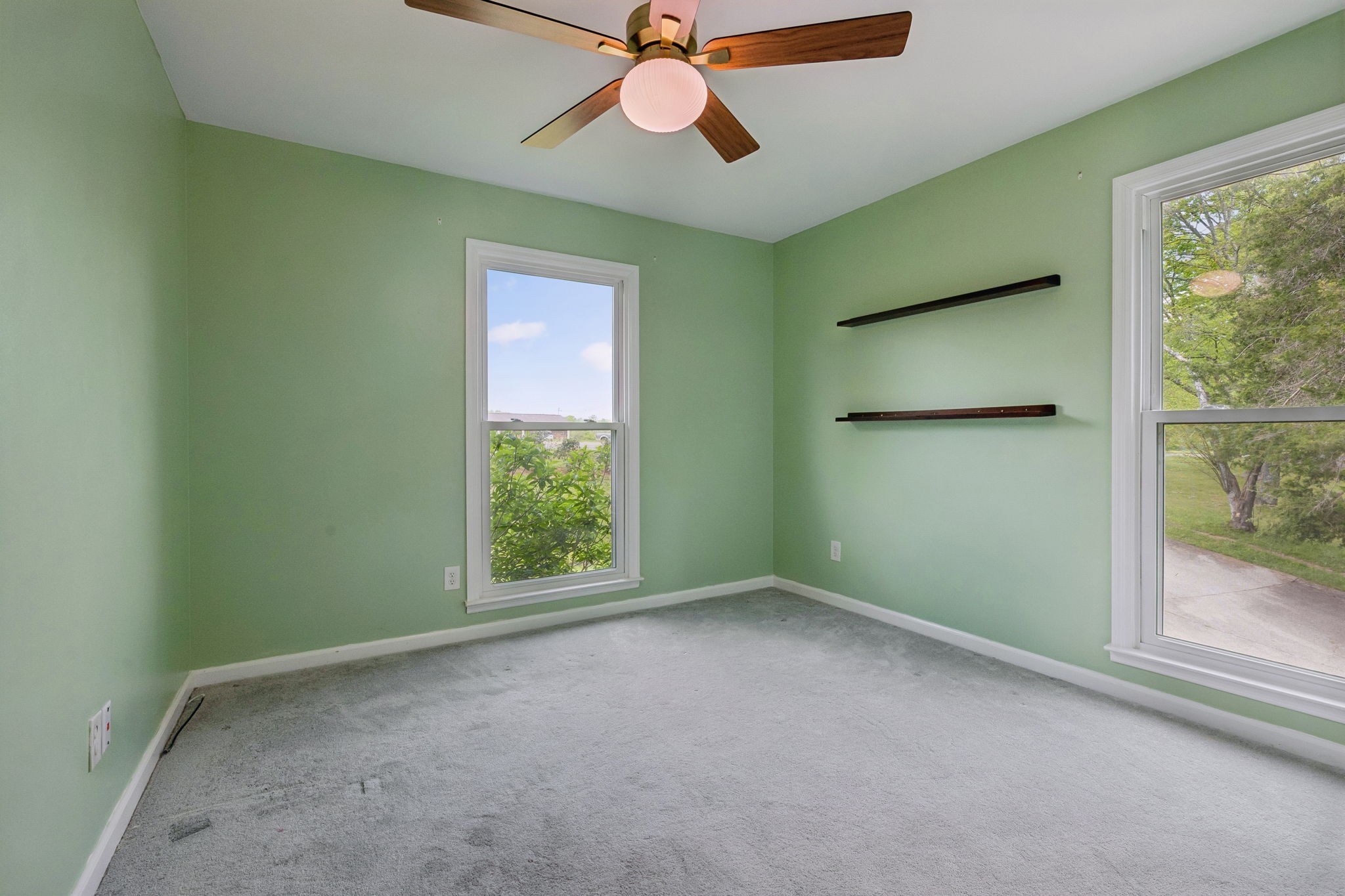 771 Mt Pleasant Road Kingston Springs, TN 37082 - Photo 18 of 31 an empty room with windows and fan