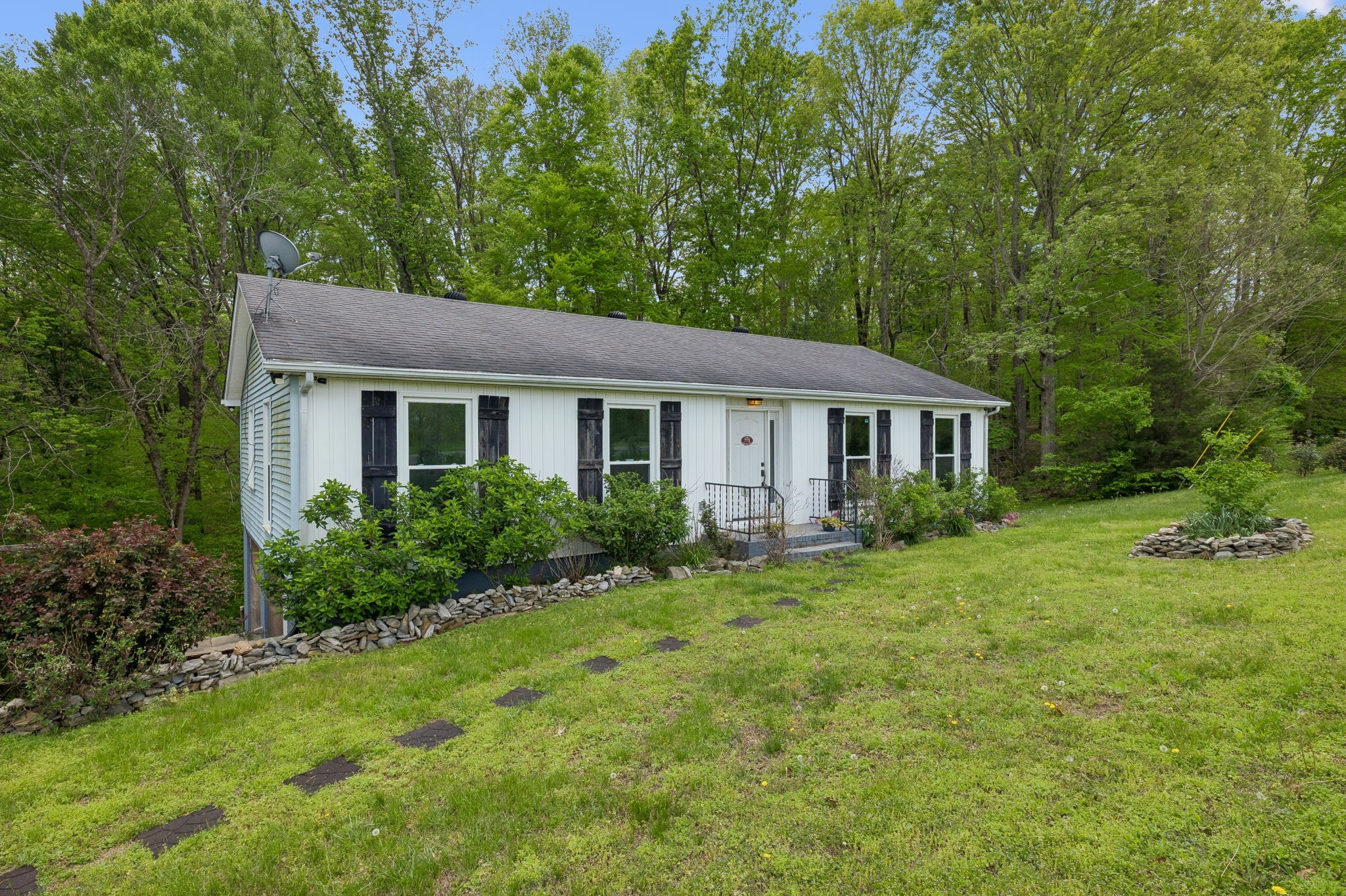 771 Mt Pleasant Road Kingston Springs, TN 37082 - Photo 2 of 31 a view of a house with backyard and garden