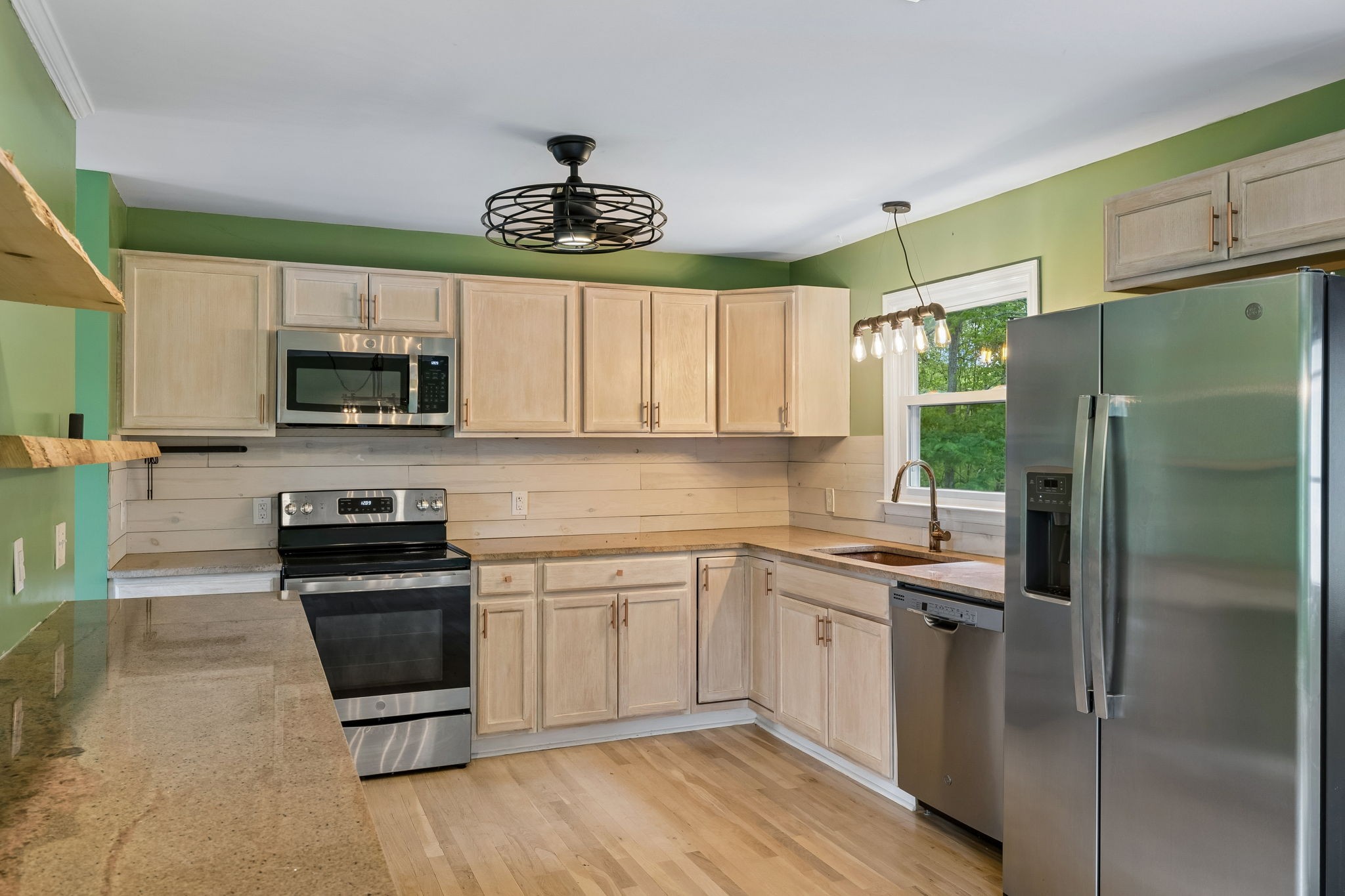 771 Mt Pleasant Road Kingston Springs, TN 37082 - Photo 10 of 31 a kitchen with a sink stainless steel appliances and cabinets