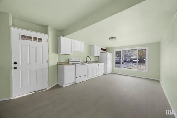 a view of a kitchen with a sink cabinets and a window