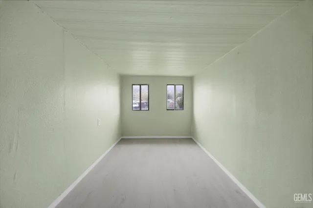 a view of an empty room and window