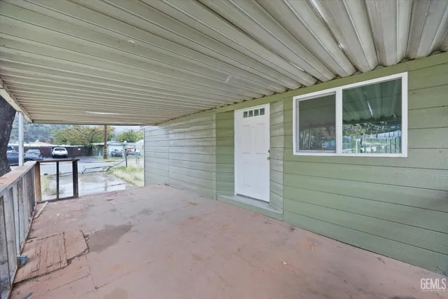 a view of a porch with furniture
