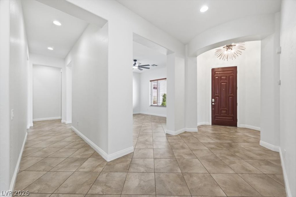 2125 De Rouge Avenue Henderson, NV 89044 - Photo 32 of 96 A graceful entry with warm tiled flooring guides you into this welcoming interior.