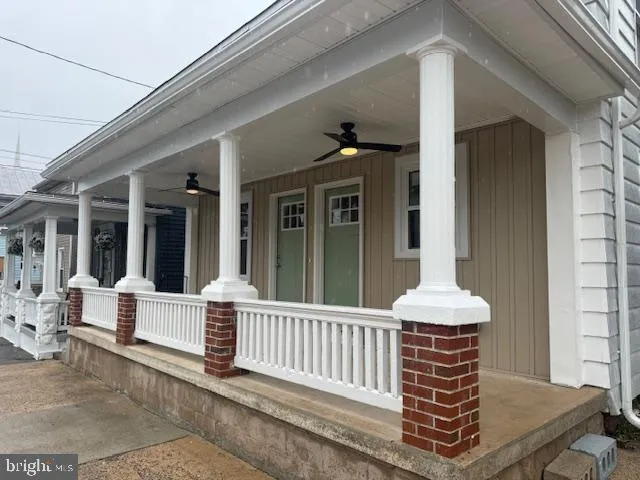 a view of a house with porch and wooden floor