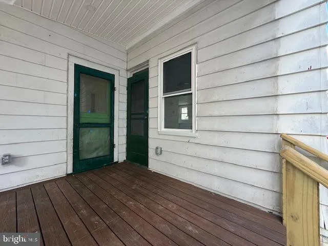 a view of front door and wooden floor
