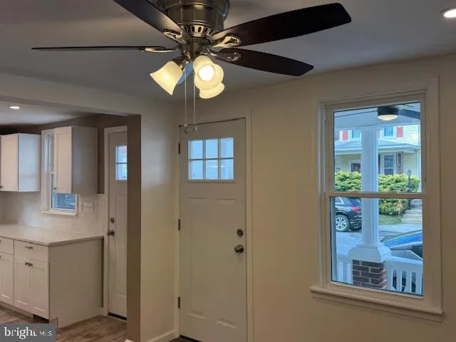 a kitchen with stainless steel appliances a refrigerator sink and microwave