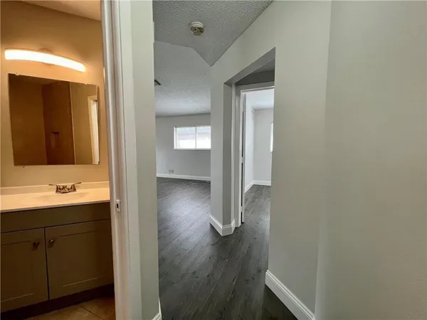 a bathroom with a sink and mirror