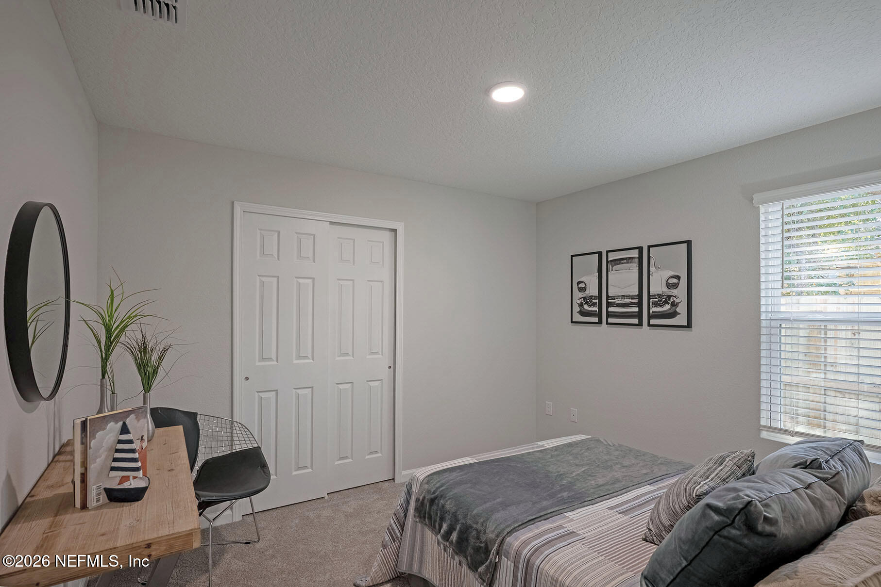 1639 Lakewood Road Jacksonville, FL 32207 - Photo 15 of 39 a bedroom with a bed and a window