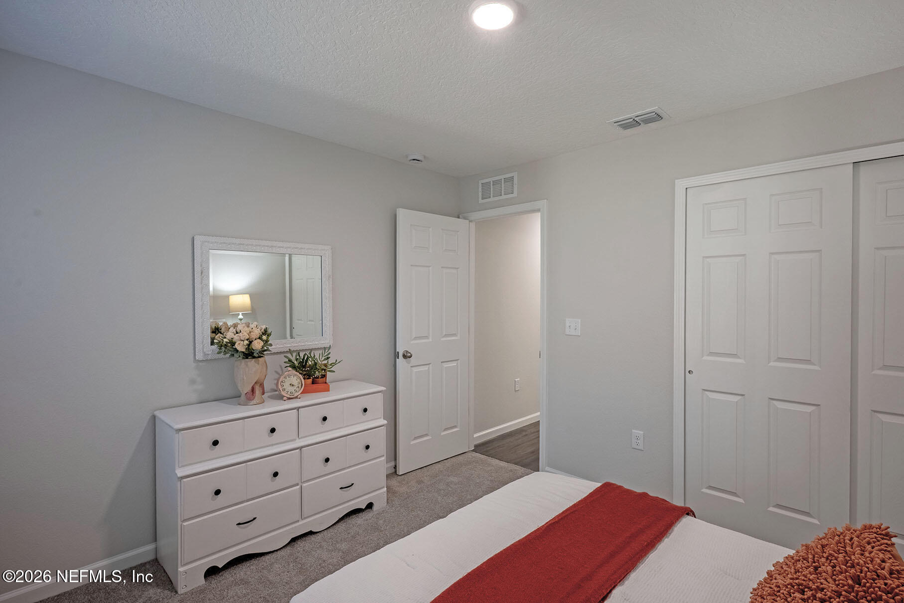 1639 Lakewood Road Jacksonville, FL 32207 - Photo 23 of 39 a bedroom with a bed and a dresser in it