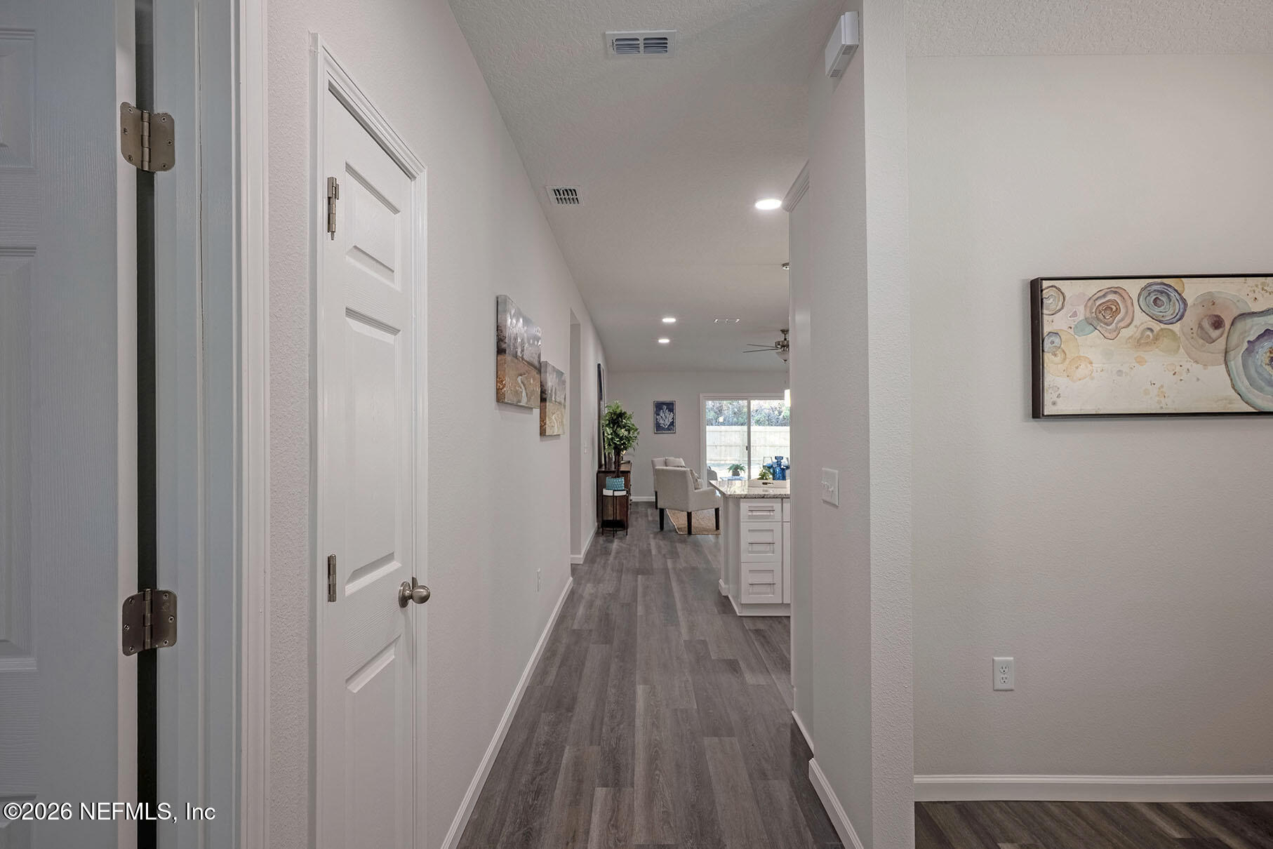 1639 Lakewood Road Jacksonville, FL 32207 - Photo 3 of 39 a view of a hallway with wooden floor windows and a livingroom